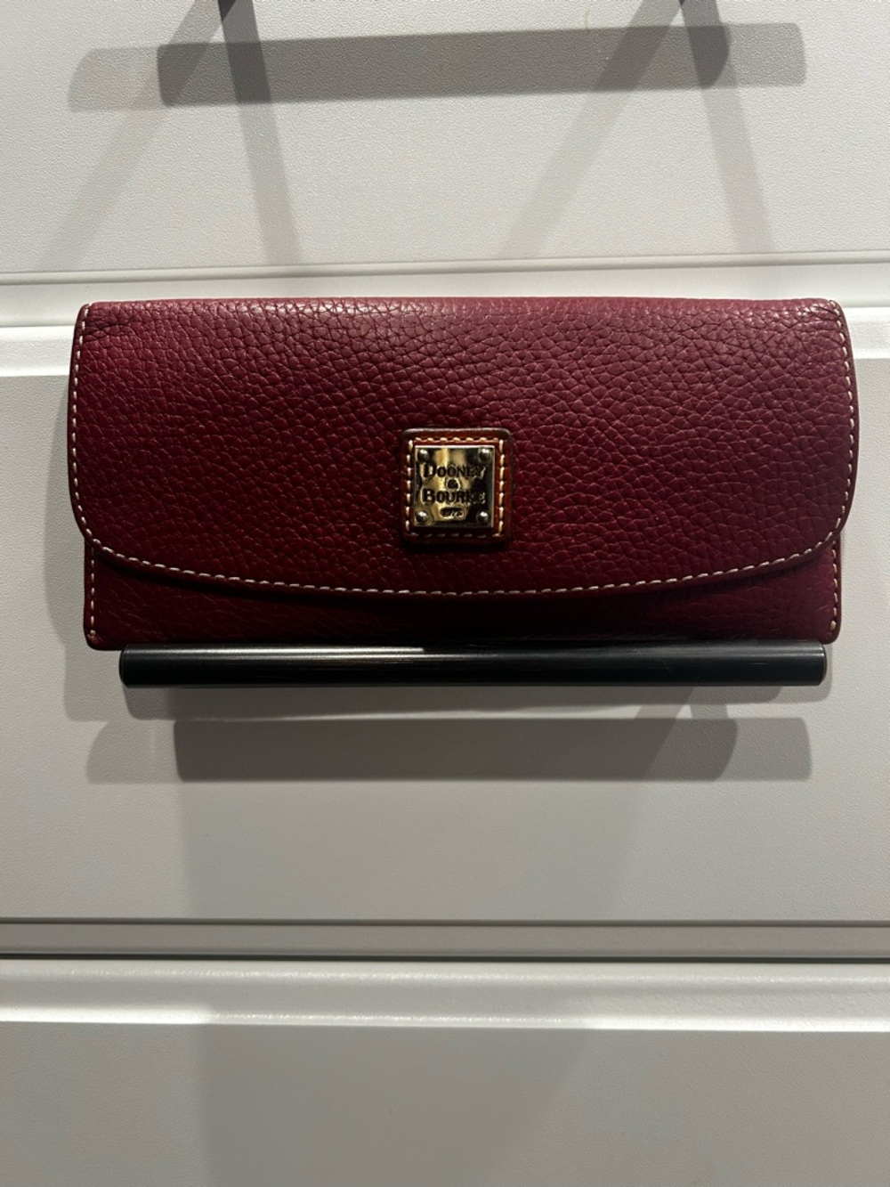 Dooney & Bourke Burgundy Pebbled Leather Continental Wallet with Gold Logo